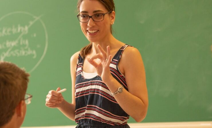 Woman in front of class