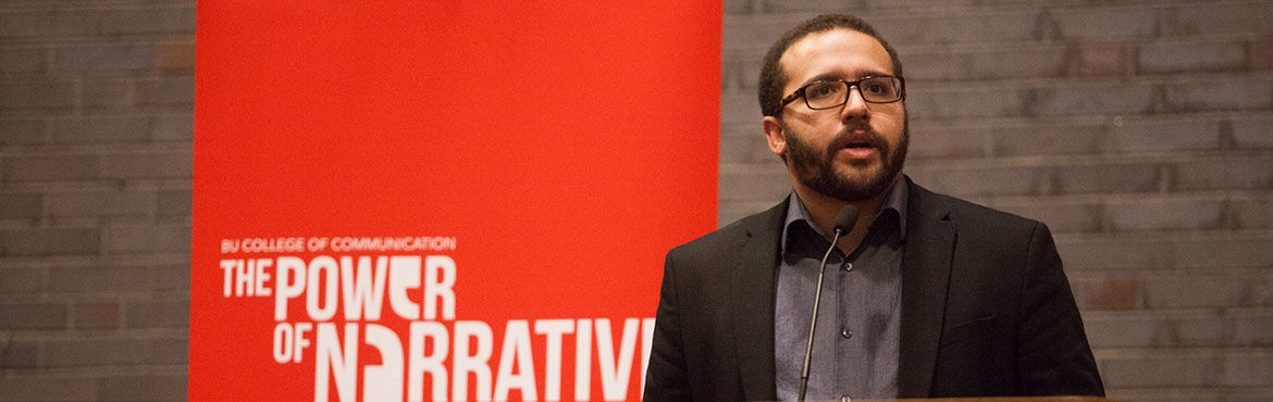 Bearded man wearing glasses speaks from the dais during the 2017 Power of Narrative conference.